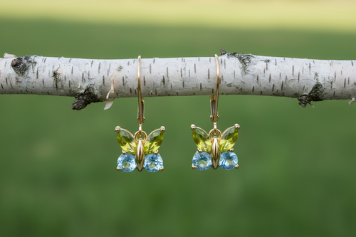 14k Yellow Gold earrings with peridot and blue topaz.