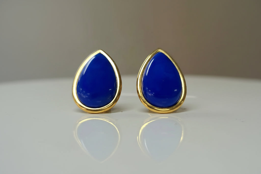 Pair of blue lapis lazuli teardrop earrings in a 14k yellow gold bezel
