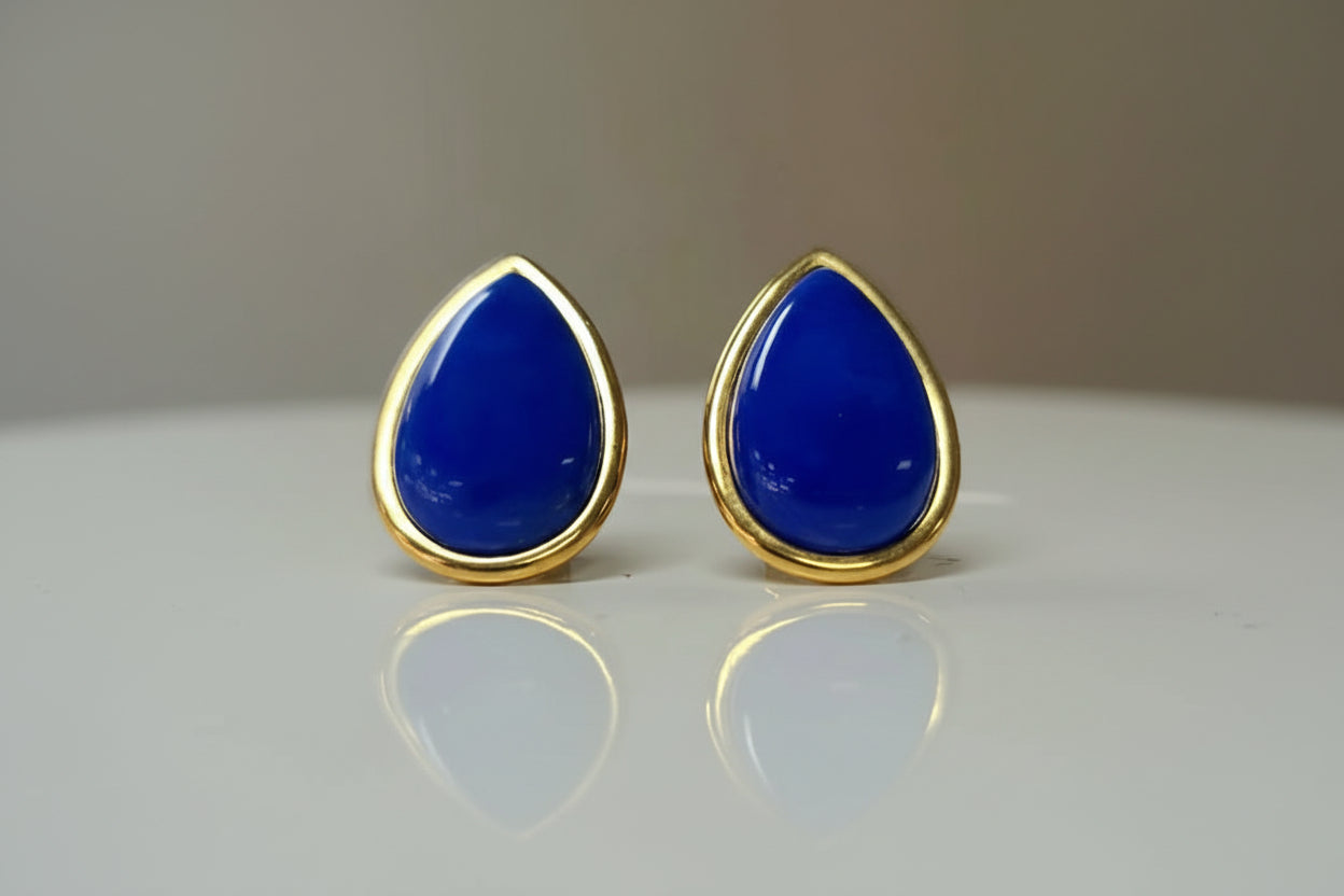 Pair of blue lapis lazuli teardrop earrings in a 14k yellow gold bezel